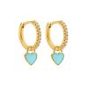 Pendientes Aro Corazón Celeste Oro ideales. Aros dorados con piedras circonitas y charm colgante en forma de corazón azul claro.